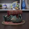 ظرف سفالی پتینه مدل ماهی دم کج در چیدمان