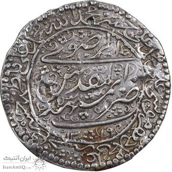 سکه پولکی نقره امام رضا (ع) 1319 - VF - مظفرالدین شاه سکه پولکی نقره امام رضا (ع) 1319 - VF - مظفرالدین شاه